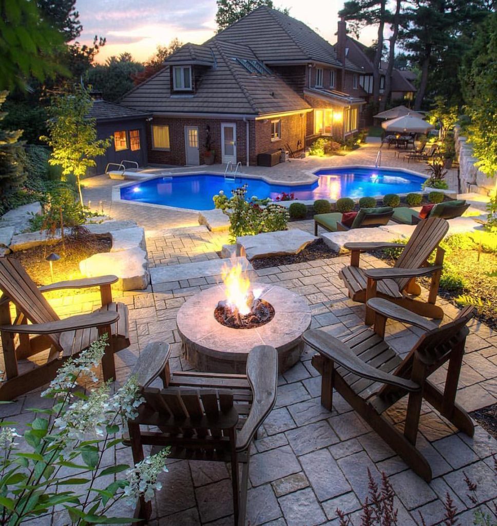Outdoor garden seating by the pool with fire place Outdoor garden seating by the pool with fire place
