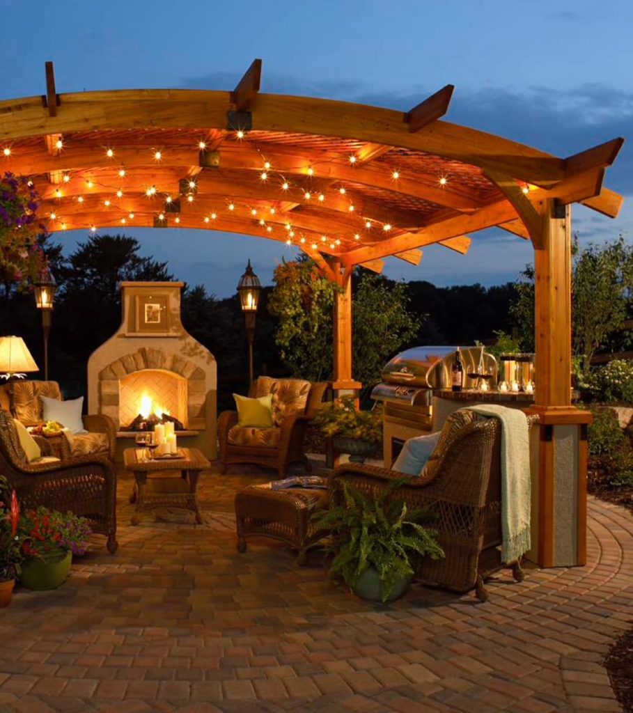 Fire place under Pergola lights Fire place under Pergola lights