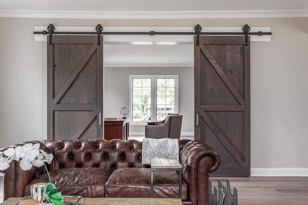 Living room double barn doors interior Living room double barn doors interior