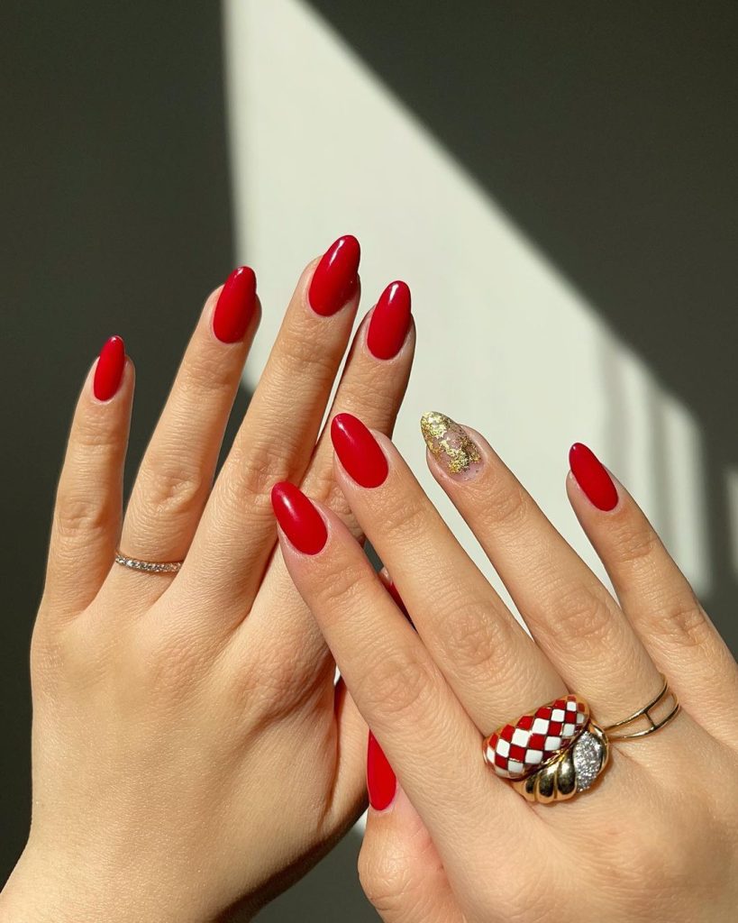 Red nails with gold accents