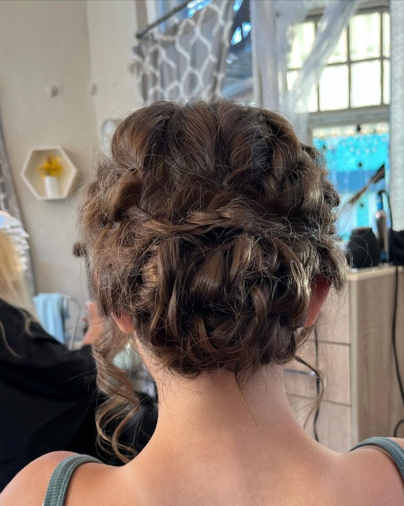 Messy cool girl bun with braids