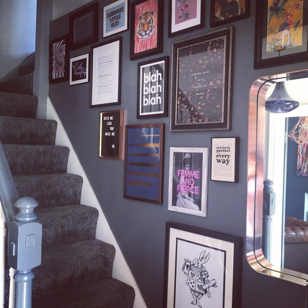 Picture frames on gallery wall staircase