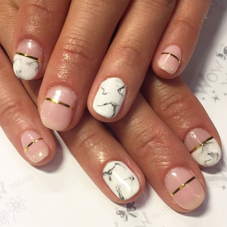 Stone pressed Marble nail design with pink and gold stripe shellac
