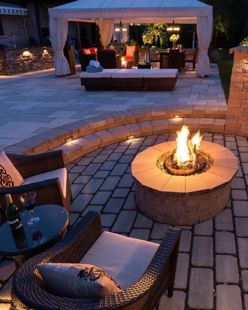 Rattan garden furniture with stone firepit